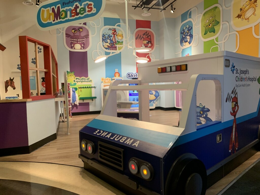 a kid-sized ambulance at the entrance to the exhibit