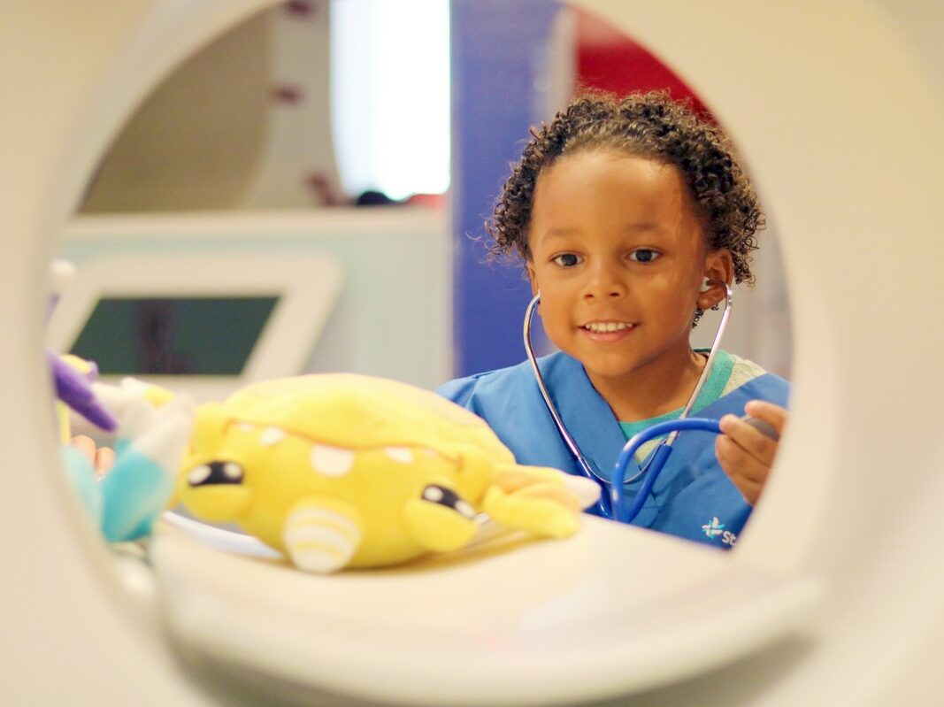 Using a pretend CT scanner, guest put plush characters inside and see their brain, heart, and lungs.