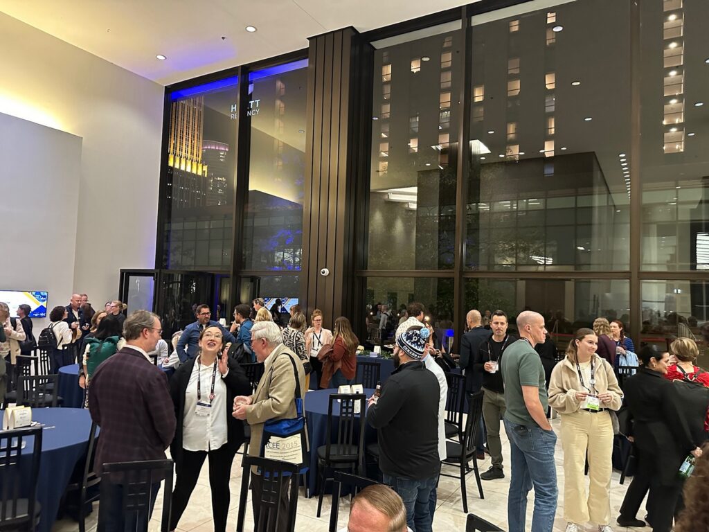 Museum professionals at the TREX Traveling Exhibitions Forum enjoying cocktails and networking at the Chicago Architecture Center prior to the start of the presentation.